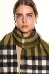 Neutral-toned cashmere scarves arranged in a luxury boutique setting