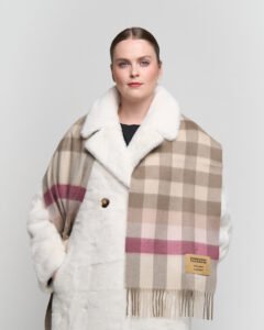 Gift-wrapped cashmere scarf next to a handwritten Valentine’s card